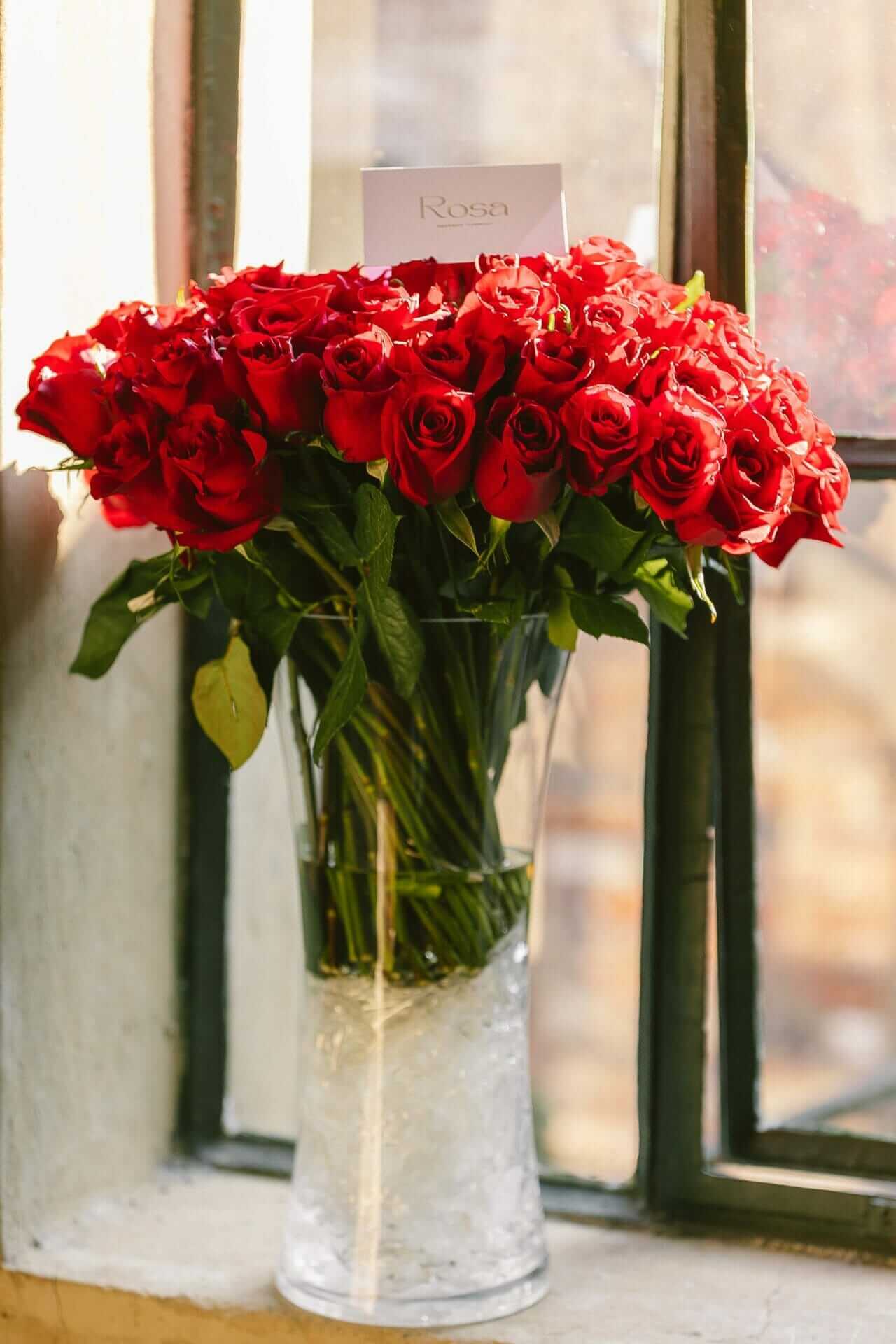 100 Ever red roses in cylinder vase (Kenyan imports)