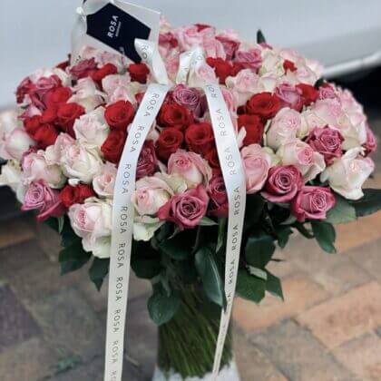 Light pink, cerise pink and purpe roses in a vase -  150 stems