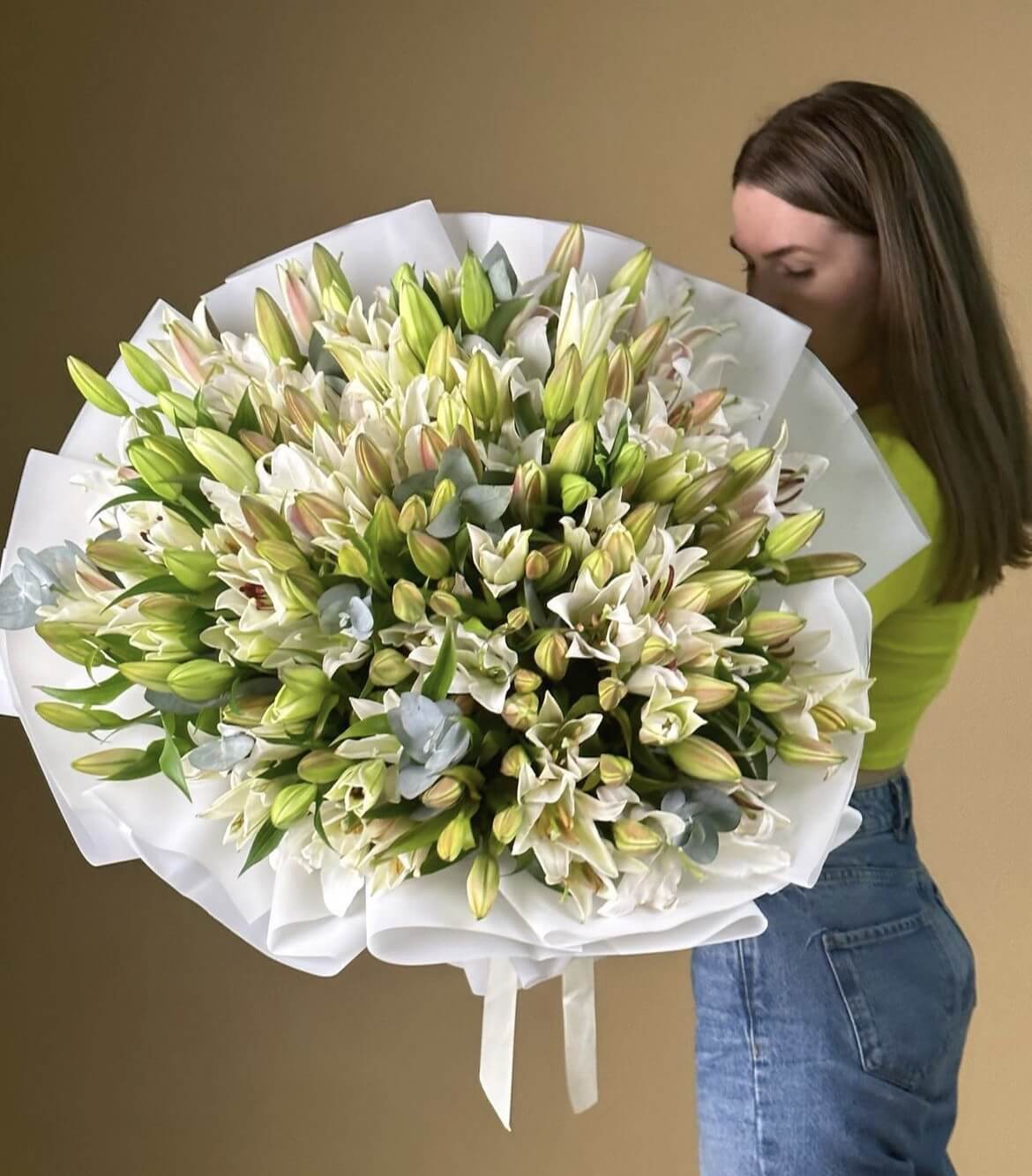 100 lilies in white wrapping (white lilies will be substitute with pink if white not available on the day of delivery)