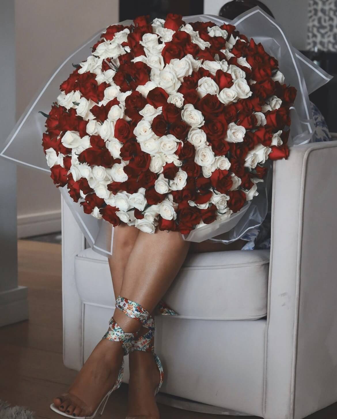 300 red and white roses mixed as a bouquet (white wrapping)