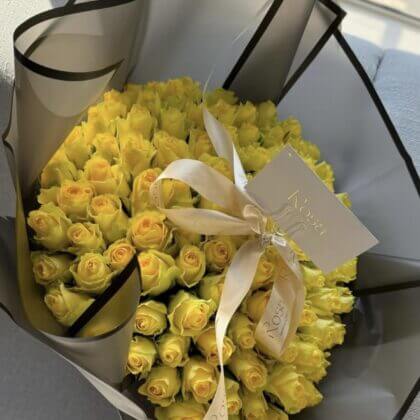80 yellow roses in black wrapping - 1 business day lead time required