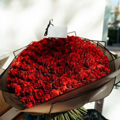 300 red roses in black wrapping