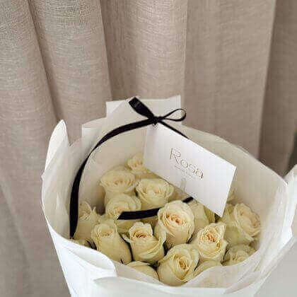 20 white roses in white wrapping