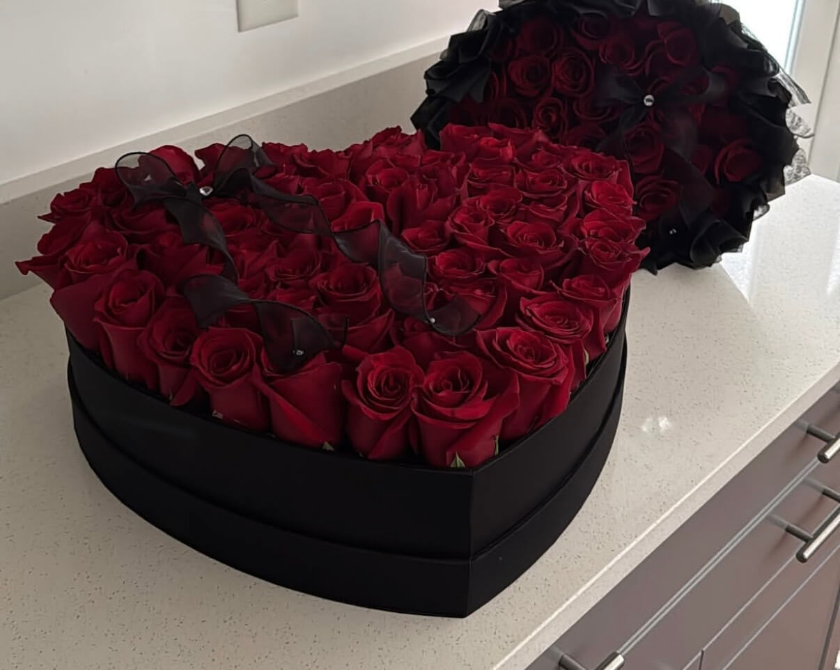 80 red roses in a black suede heart boxes